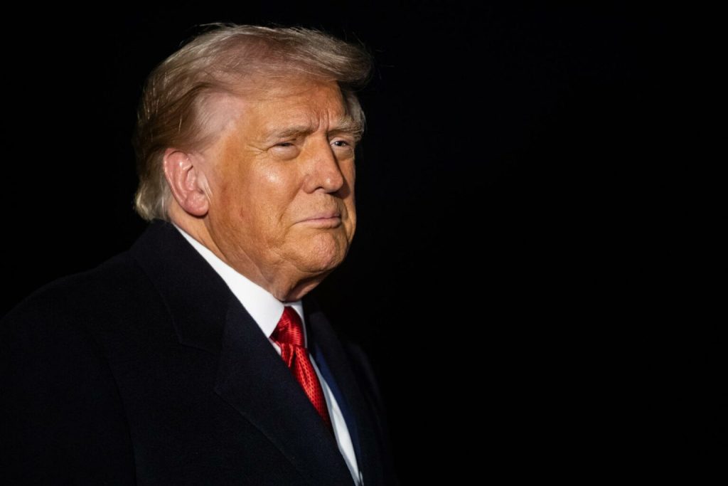 US President Donald Trump speaks with reporters while departing from the White House